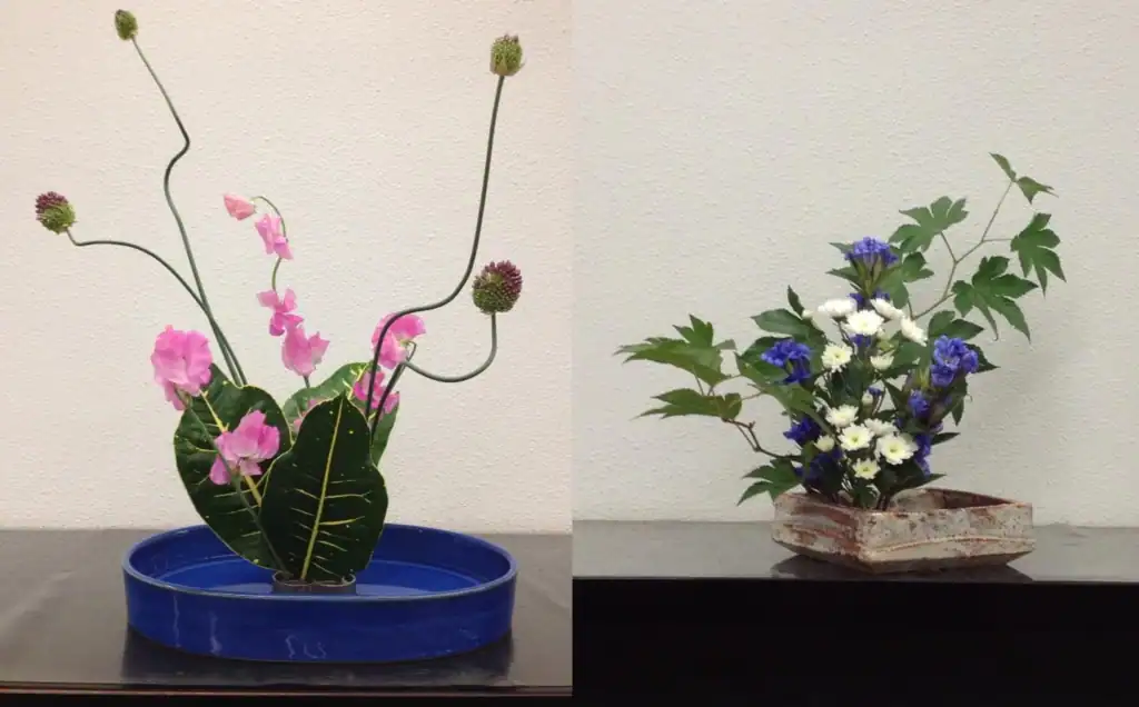 Two ikebana flower arrangements created by participants in RESOBOX's virtual ikebana class — a pink sweet pea with allium in a blue dish, and blue gentian with white chrysanthemums in a rustic ceramic vessel