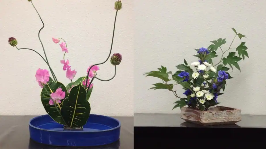 Two ikebana flower arrangements created by participants in RESOBOX's virtual ikebana class — a pink sweet pea with allium in a blue dish, and blue gentian with white chrysanthemums in a rustic ceramic vessel