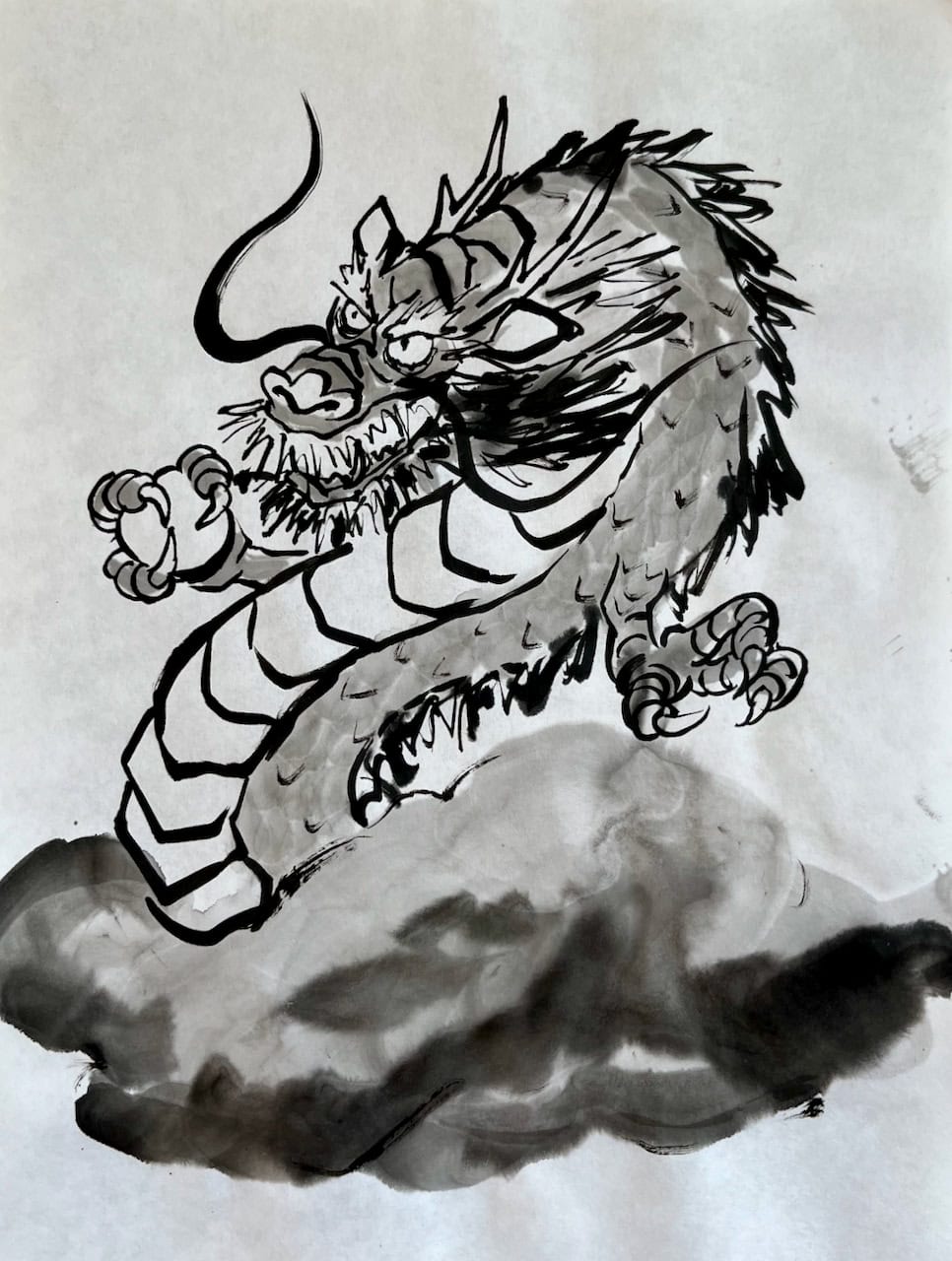 A sumi-e instructor's demonstration painting of a dragon rising above clouds, executed with dynamic brushstrokes in traditional Japanese ink wash style