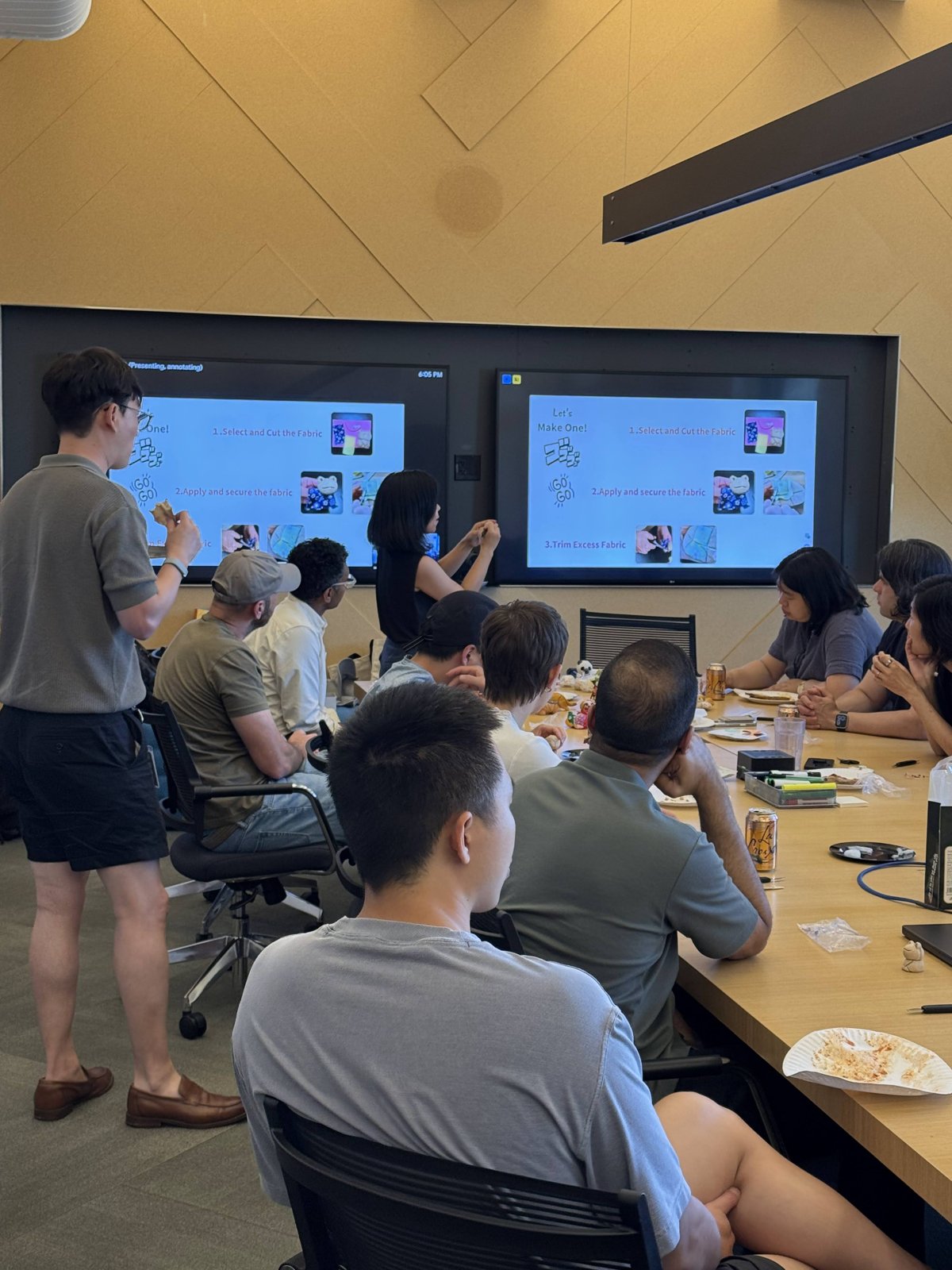 Participants following the kimekomi steps on screen while working on their dolls