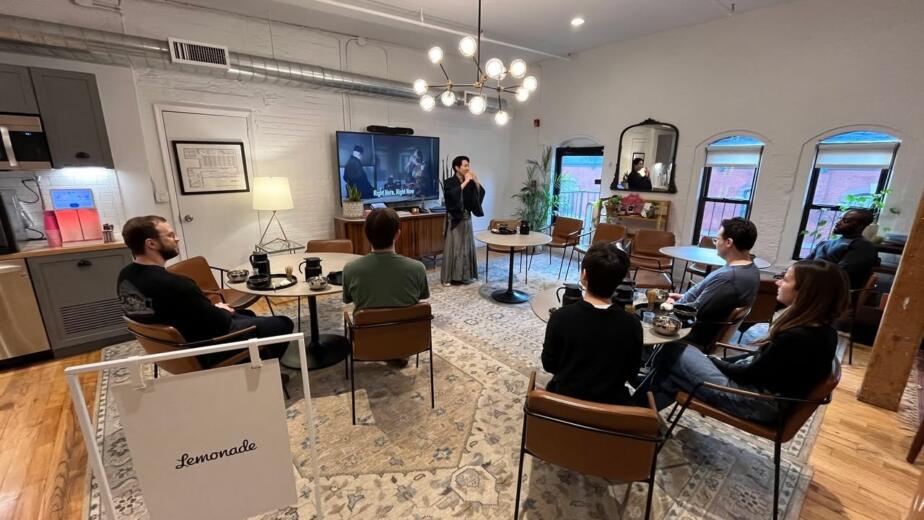 Japanese tea ceremony workshop at the Lemonade office, with a kimono-clad tea master presenting to seated employees