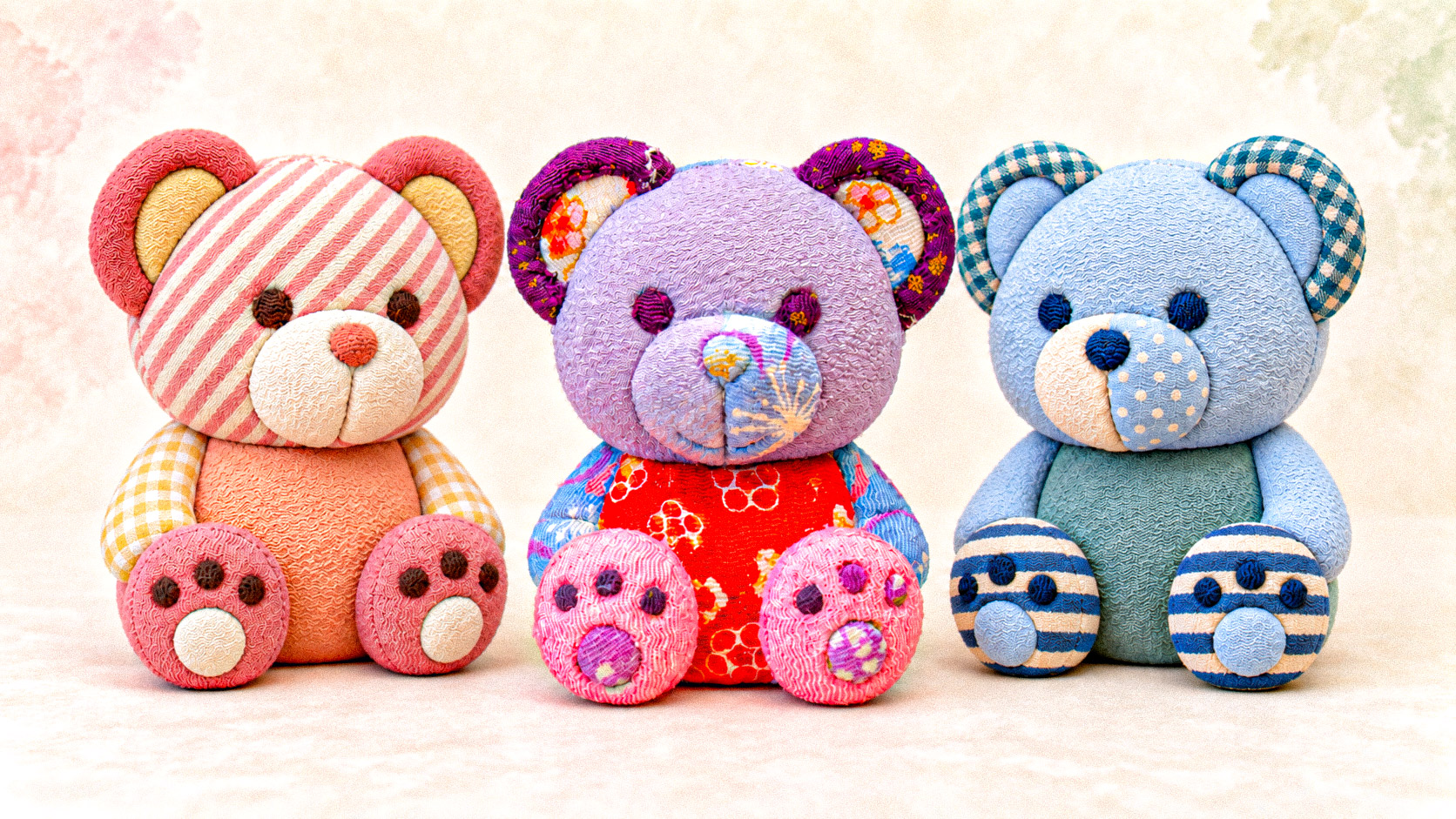 Kimekomi Bear (November 22, 2026) Kimekomi bear dolls in pink, lavender and blue chirimen fabric